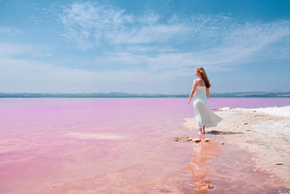 back-view-cute-teenager-woman-wearing-white-dress-walking-amazing-pink-lake